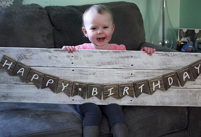 charlotte modeling the pallet wood bunting banner