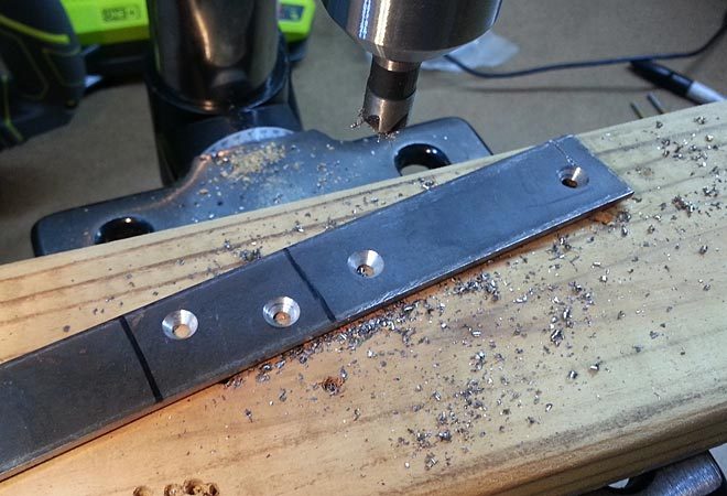 drill mounting holes in the flat bar and countersink them