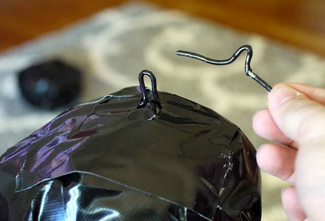 attach clips made from hanger wire to the ball