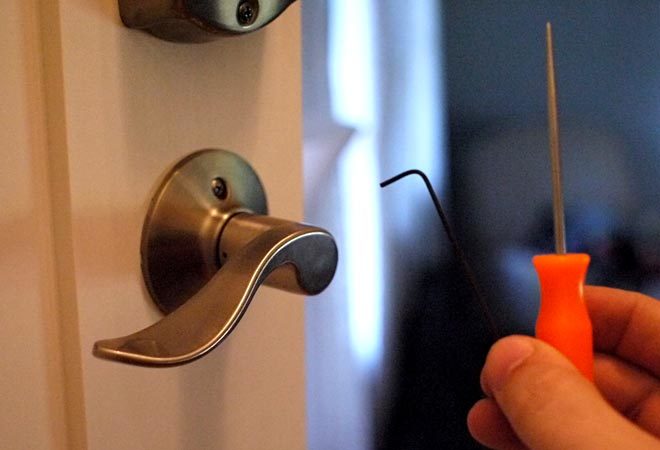 use a pick, hex wrench, or paperclip to flip a lever handle