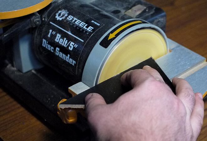 sanding the sides of the chalkboard banner flags