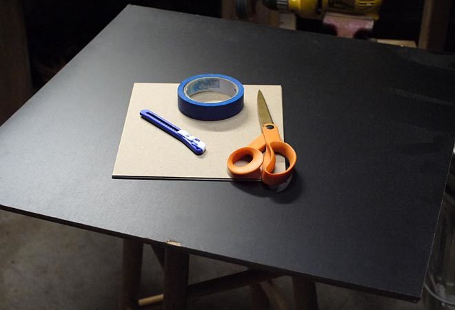 tools and supplies needed for making a chalkboard banner